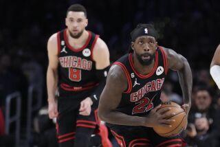Chicago Bulls guard Patrick Beverley (21) readies to pass during the first half of an NBA basketball game against the Los Angeles Lakers Sunday, March 26, 2023, in Los Angeles. (AP Photo/Marcio Jose Sanchez)