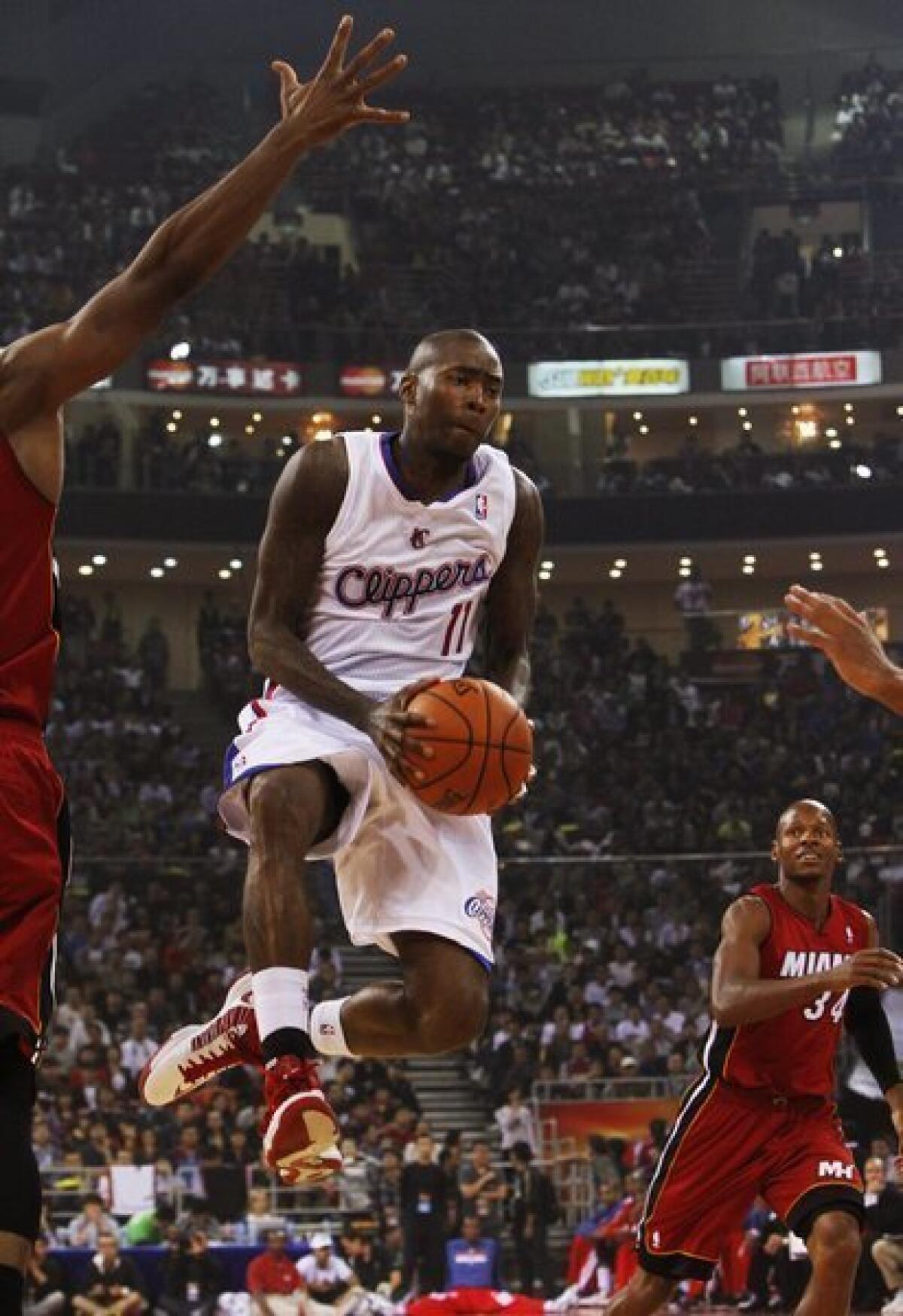 Jamal Crawford handles the ball during the Clippers' loss to Miami on Thursday.