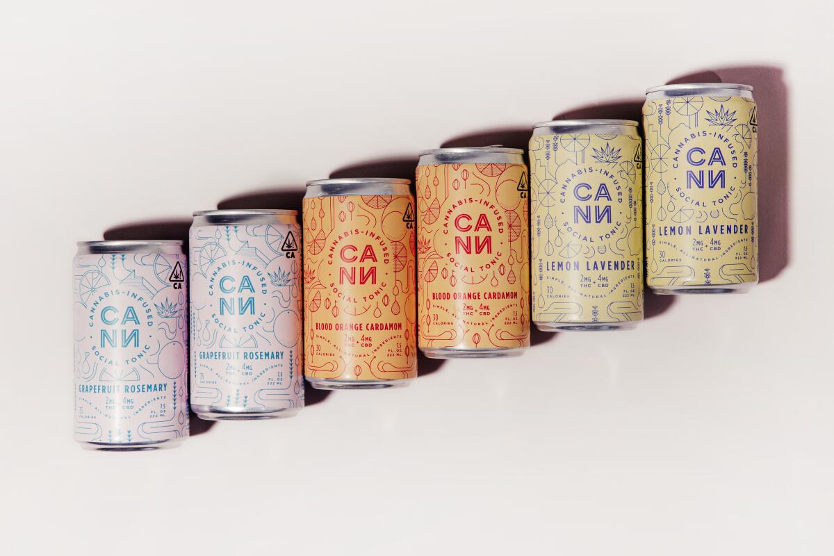 Six cans of THC-infused beverages arranged on a diagonal.