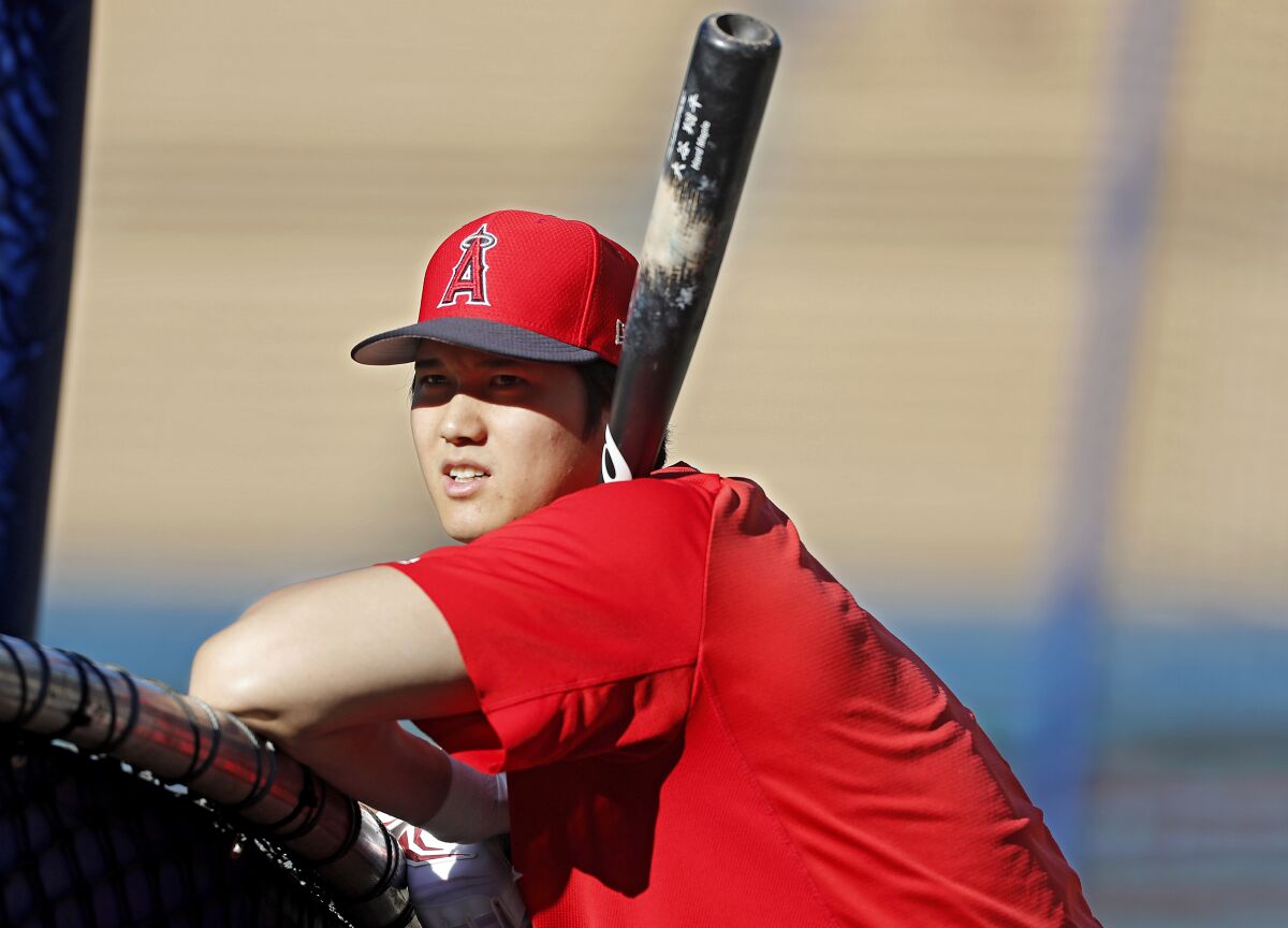 Angels designated hitter Shohei Ohtani warms up before a game.