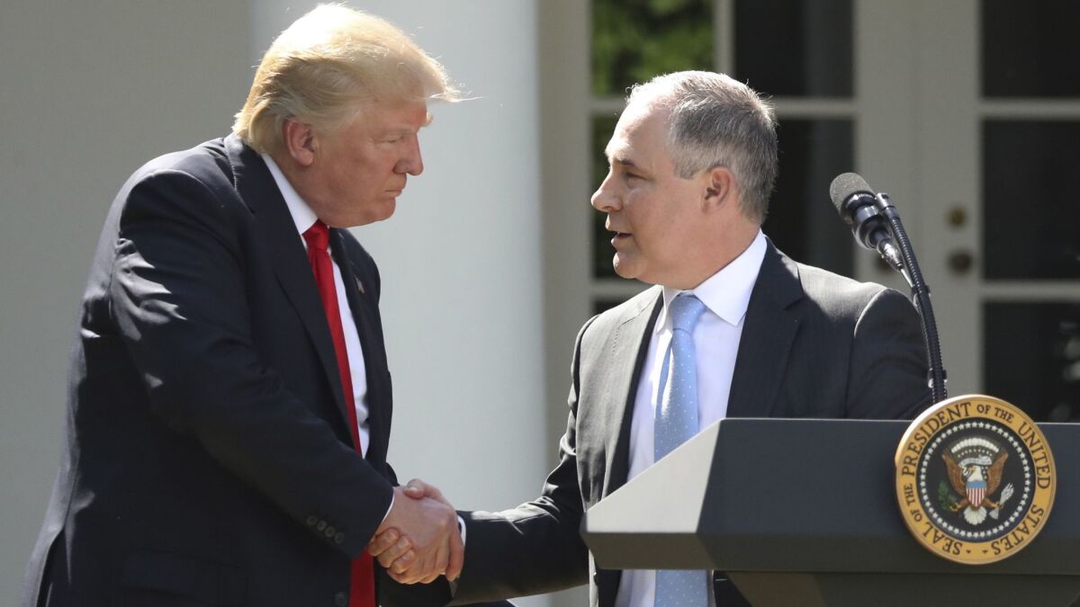 President Trump shakes hands with EPA Administrator Scott Pruitt in June 2017.