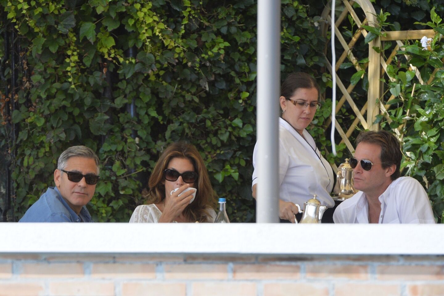 Groom George Clooney dines with supermodel pal Cindy Crawford and business partner Rande Gerber, her husband, at the Cipriani Hotel in Venice on Saturday before his wedding to Amal Alamuddin.