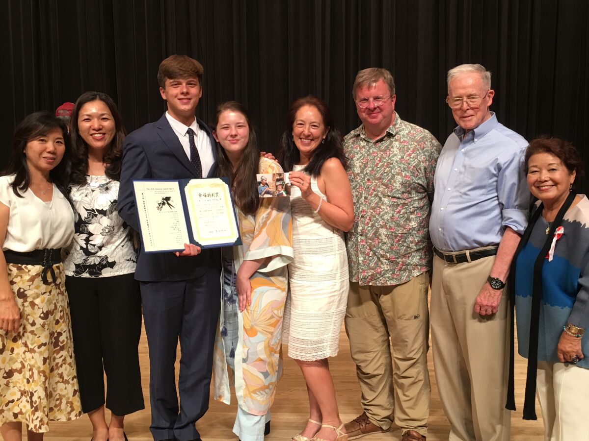 Zane Adlam with his family and support team after placing third in the International High School Japanese Speech Contest.