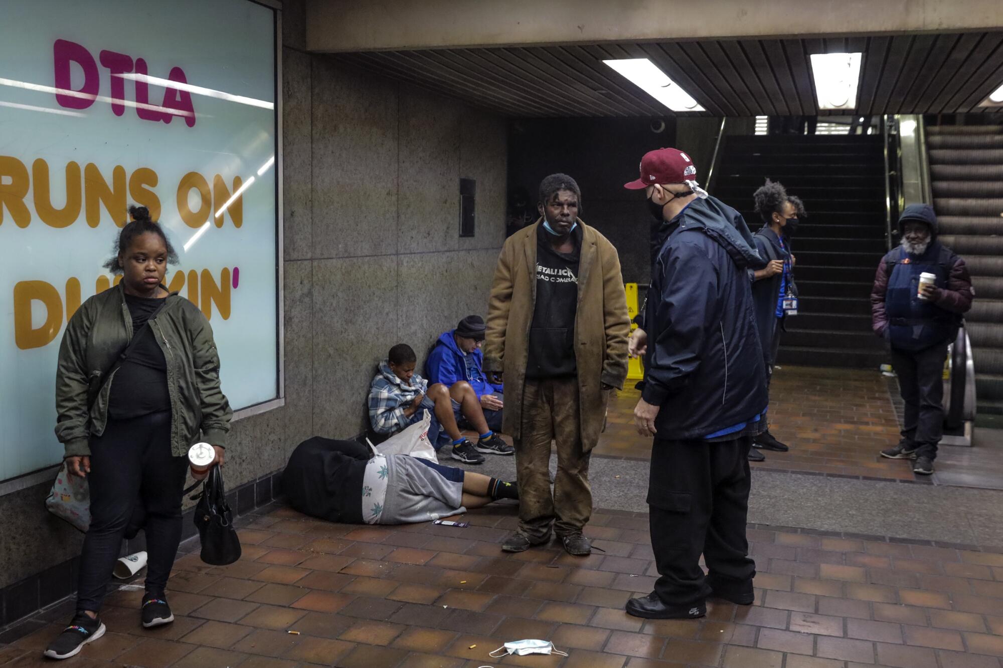 John Hargrave, PATH outreach worker, right, talks to Tracy Hellams