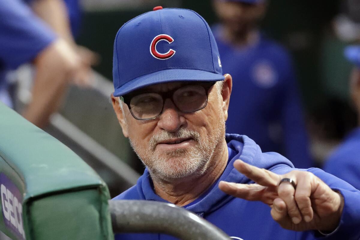 Joe Maddon waves to a fan before the Chicago Cubs played the Pittsburgh Pirates on Sept. 24 at PNC Park. The Angels have hired Maddon as their manager.