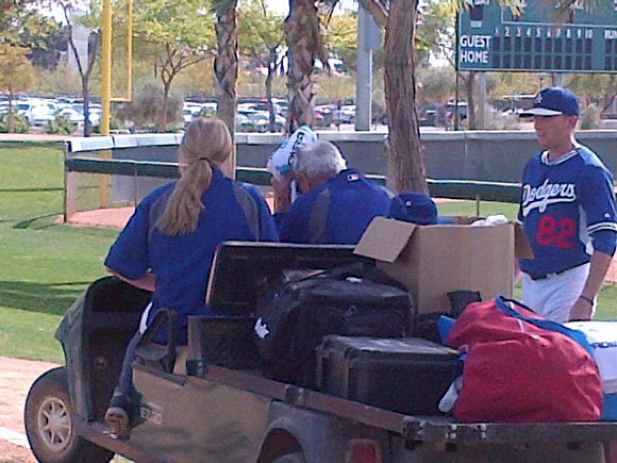 Sandy Koufax is driven away on a cart after being hit in the head by a line drive.