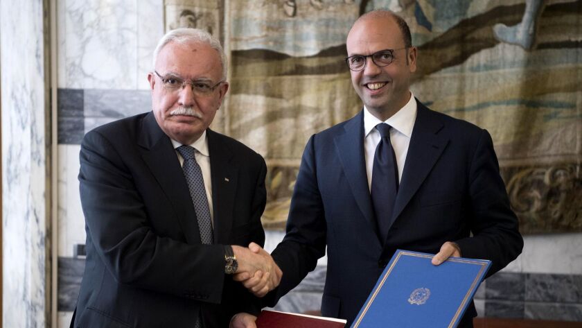 Palestinian Foreign Minister Riyad Maliki, left, with his Italian counterpart Angelino Alfano during a visit to Rome on Nov. 9. On Nov. 18, Maliki said the U.S. threat to shut the Palestinian office in Washington amounts to "extortion."