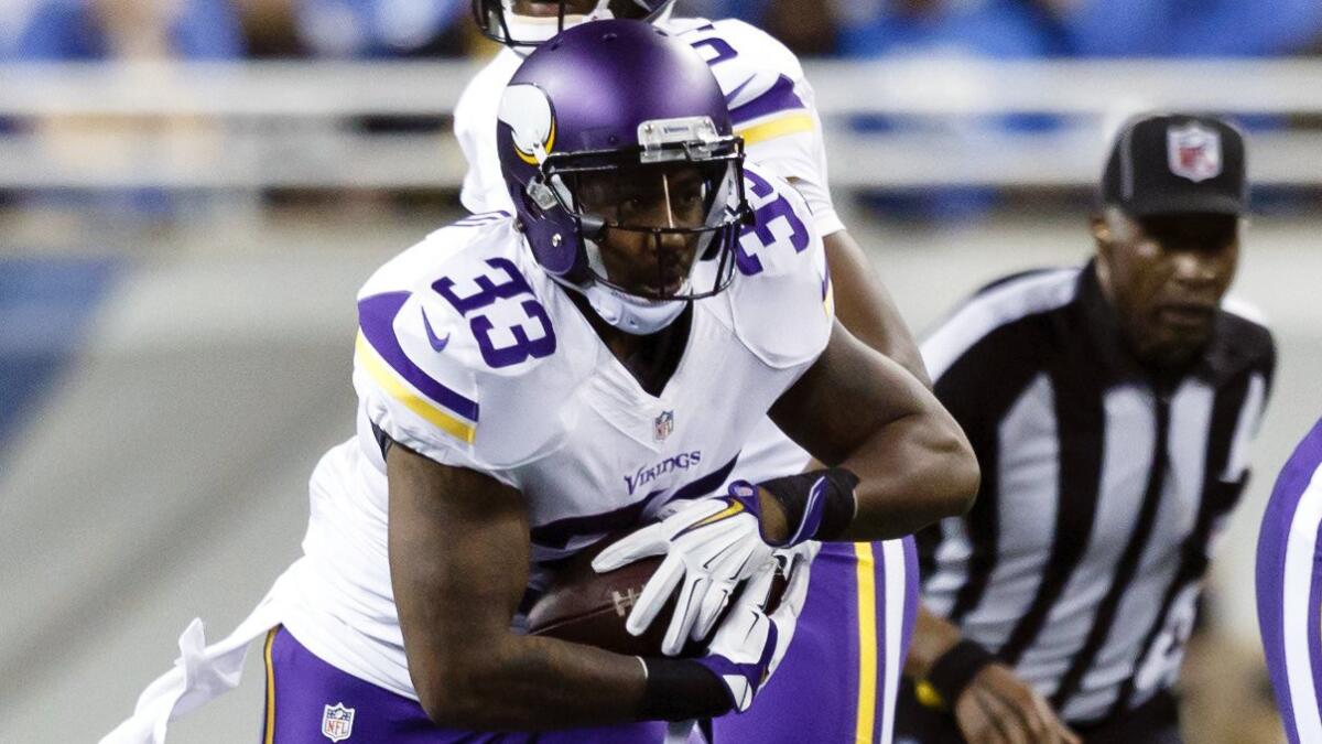 Minnesota Vikings running back Ben Tate carries the ball against the Detroit Lions on Dec. 14. Tate signed with the Pittsburgh Steelers on Tuesday.