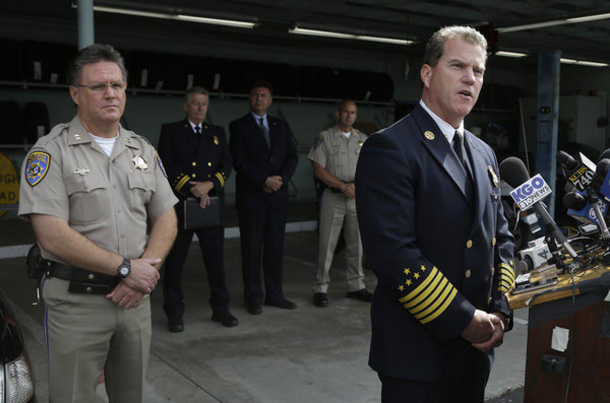 Foster City Fire Department Chief Michael Keefe, right, speaks next to Redwood City California Highway Patrol Commander Mike Maskarich at a news conference at the California Highway Patrol headquarters in Redwood City, Calif., Monday, May 6, 2013.