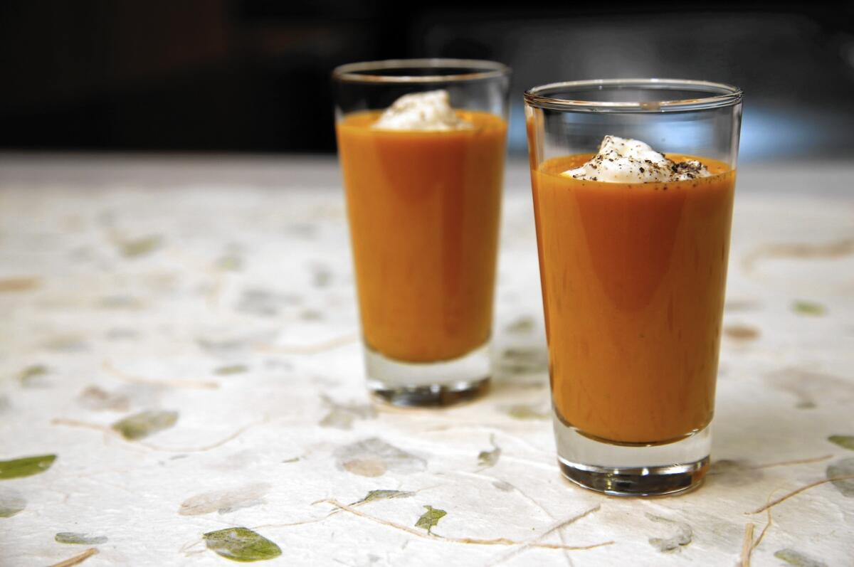 Spicy gazpacho shooter with goat cheese cream: This summery cold soup helps beat the heat.