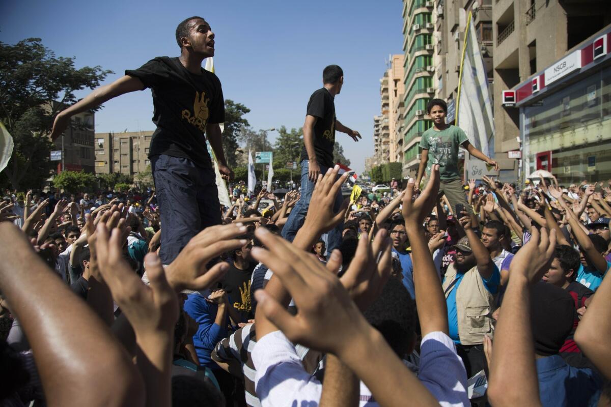 Supporters of ousted Egyptian president Mohamed Morsi chant slogans against the army during a Cairo protest.