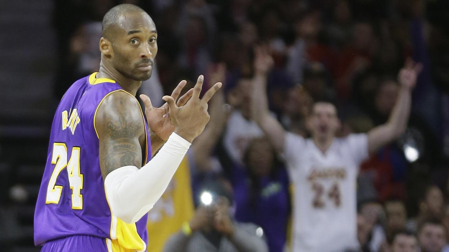 Lakers guard Kobe Bryant reacts after hitting a three-pointer during the second half of a 106-96 win over the Detroit Pistons on Tuesday.