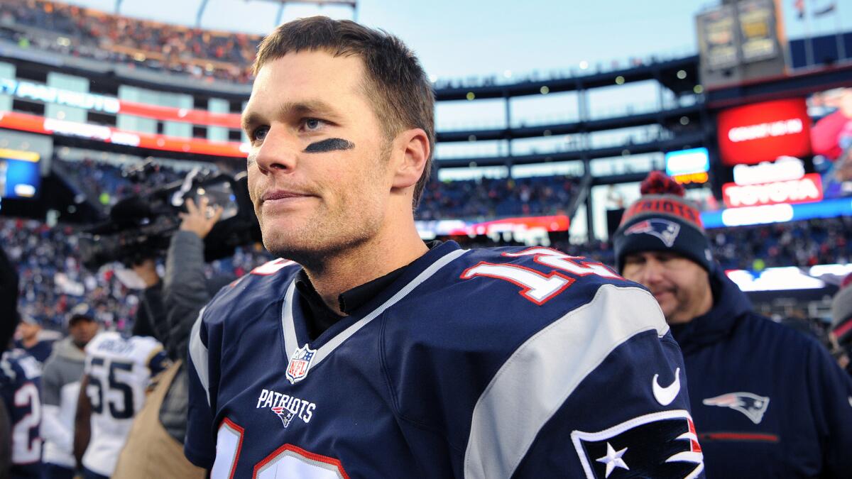 Patriots quarterback Tom Brady looks on during the first half of his 201st career victory, a win over the Rams, 26-10, at Gillette Stadium on Dec. 4.