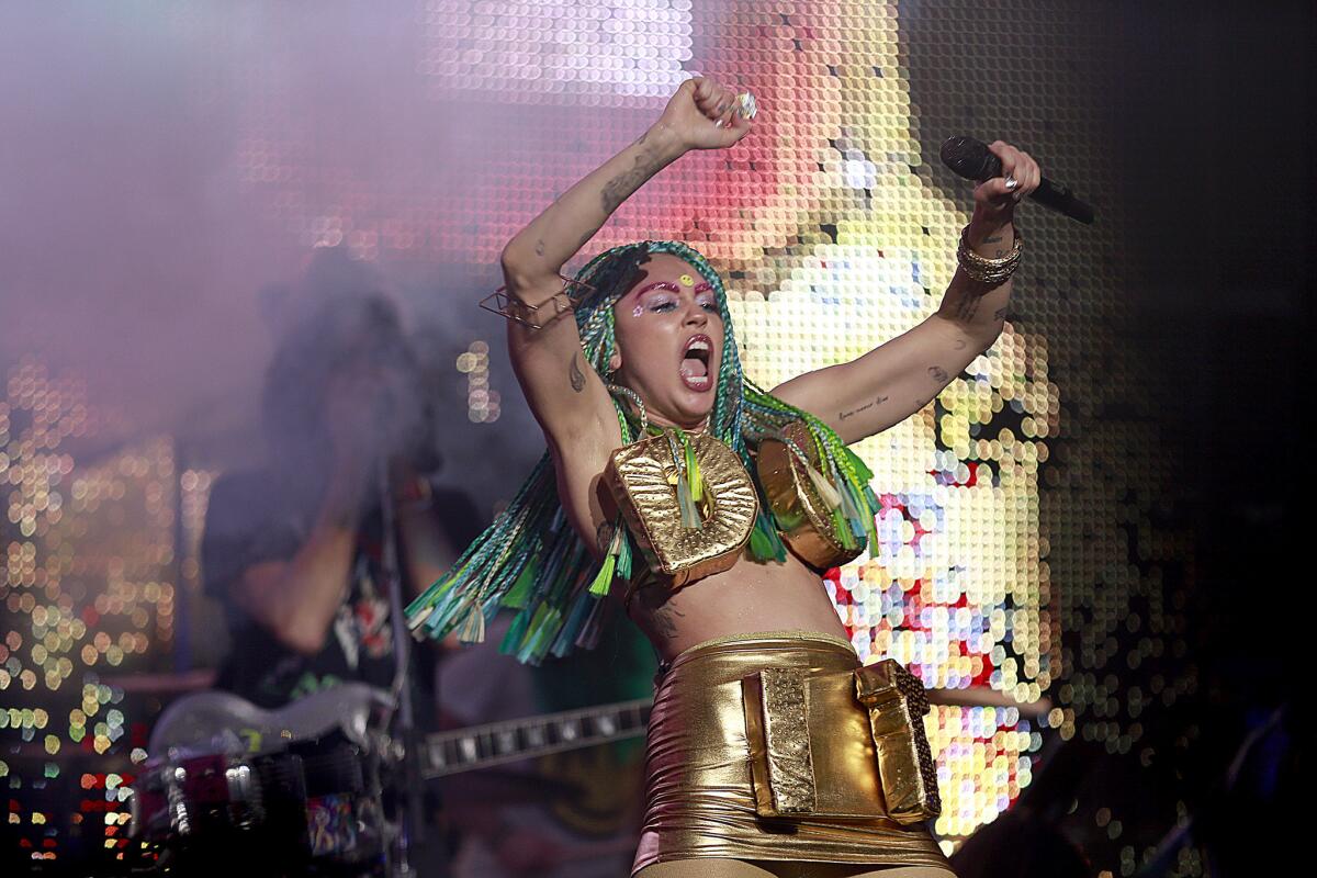 Wild costumes played a part in Miley Cyrus' show Saturday at the Wiltern.