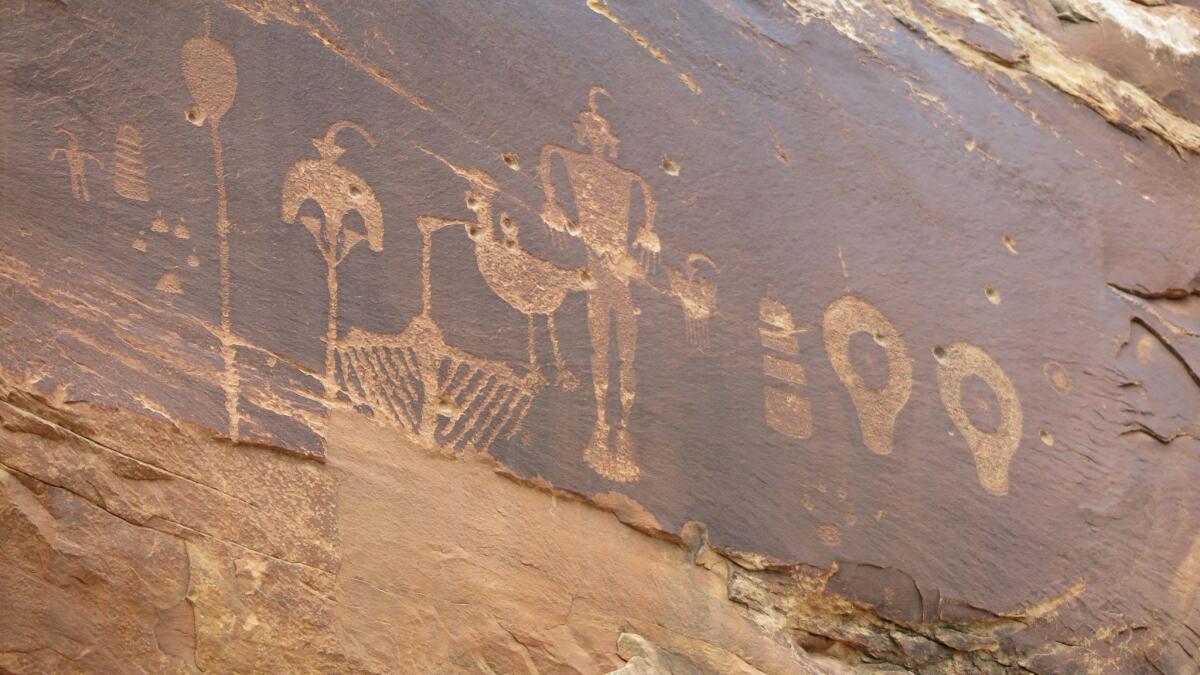 Petroglyphs marred by bullet holes. Native Americans sought monument status to protect ancient cultural sites.