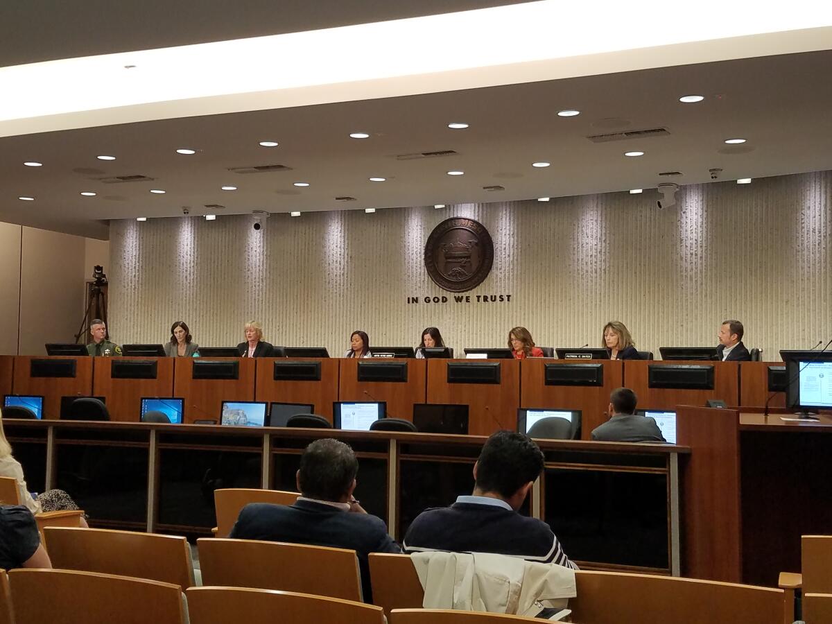 Panelists speak during an informational Assembly Accountability and Administrative Review Committee hearing Wednesday at Costa Mesa City Hall. The hearing focused on how to regulate the addiction-treatment industry.