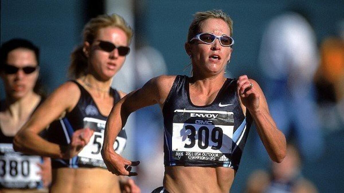 Suzy Favor Hamilton, right, runs in the 2002 U.S. Outdoor Track and Field Championships.