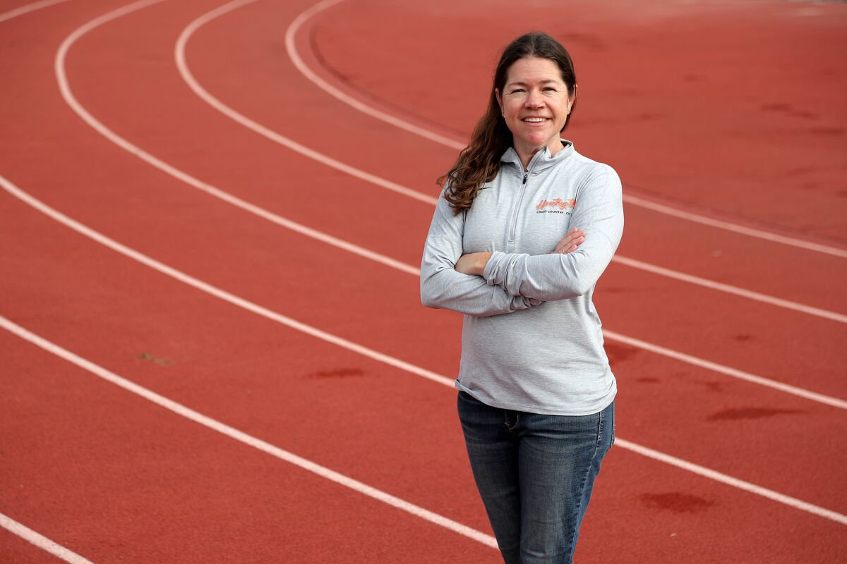 Huntington Beach's Kareen Shackelford is the Daily Pilot Girls' Cross-Country Coach of the Year.