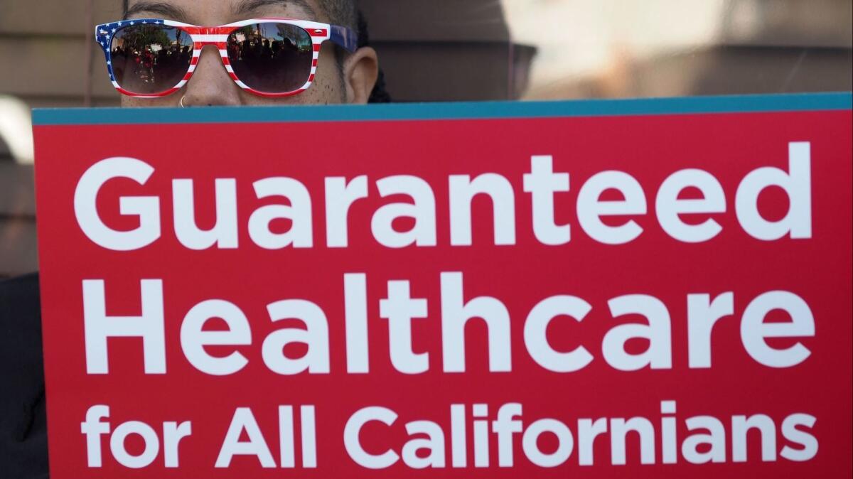 People rally in favor of single-payer healthcare for all Californians as the US Senate prepares to vote on the Senate GOP healthcare bill, outside the office of California Assembly Speaker Anthony Rendon, June 27, 2017 in South Gate, Calif.