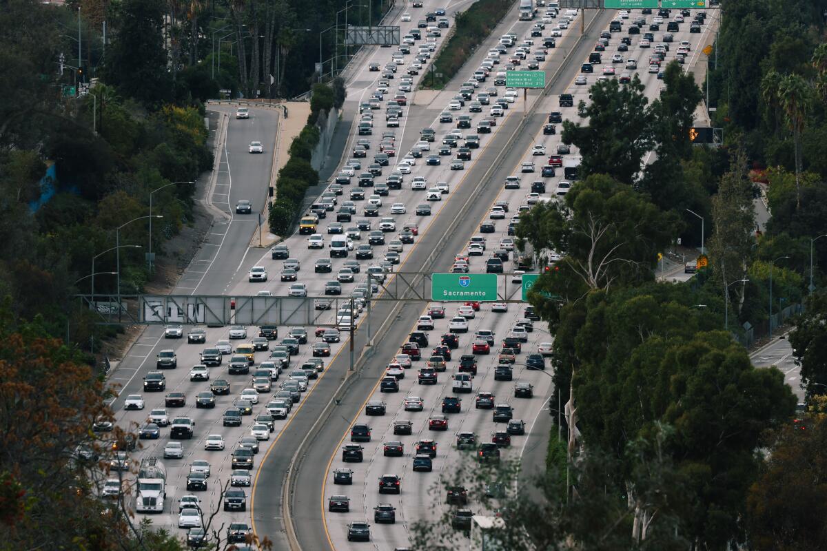 Heavy traffic moves along the 5 Freeway in Los Angeles. 