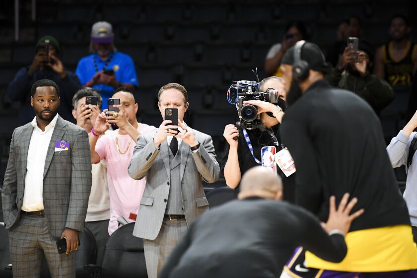 LOS ANGELES, CA - APRIL 28: People watch and record on their phones as Los Angeles Lakers forward LeBron James (6) warms up before the game against the Oklahoma City Thunder at Crypto.com Arena on Thursday, April 28, 2016 in Los Angeles, CA.(Wally Skalij / Los Angeles Times)