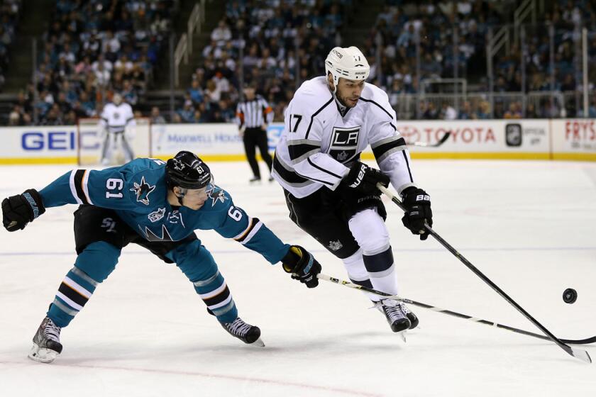 The Kings' Milan Lucic, right, and the Justin Braun go for the puck in Game 4 of the Western Conference first-round series on April 20.