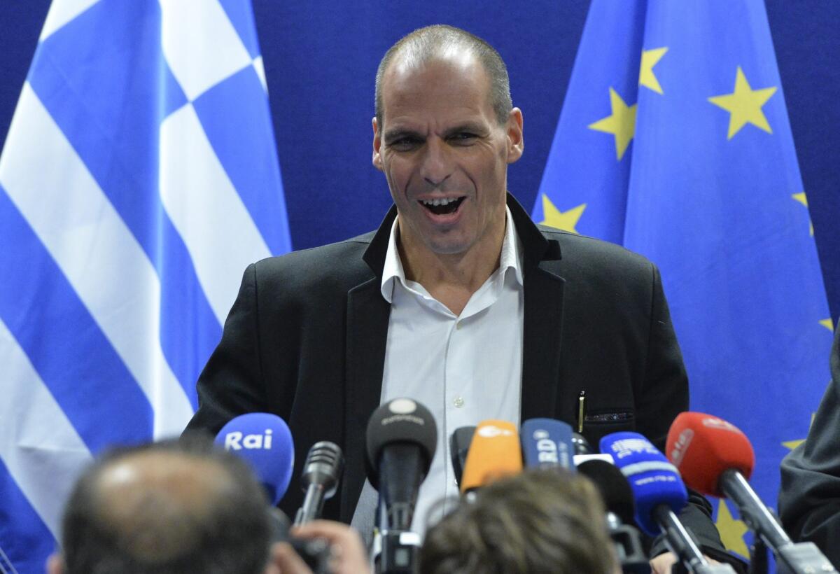 Greek Finance Minister Yanis Varoufakis gives a press briefing at the end of special Eurogroup meeting of Finance ministers at EU council headquarters, in Brussels, Belgium where Greece reached an agreement with its eurozone partners on a four-month bailout extension.
