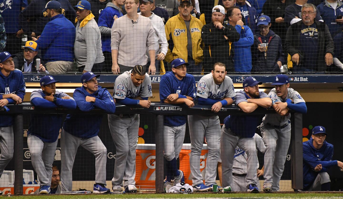 Dodgers players can only watch as Brewers win 7-2 to force a game seven.