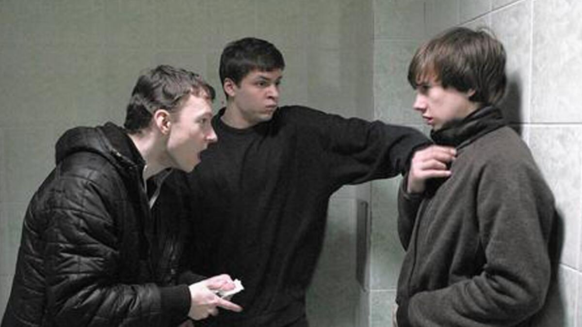 Sergey (Grigoriy Fesenko) and Shnyr (Alexandr Sidelnikov) threaten a schoolmate in “The Tribe.”