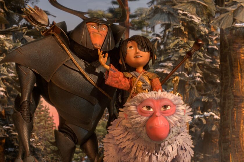 Beetle, Kubo and Monkey emerge from the forest and take in the beauty of the landscape in the animated movie "Kubo and the Two Strings."