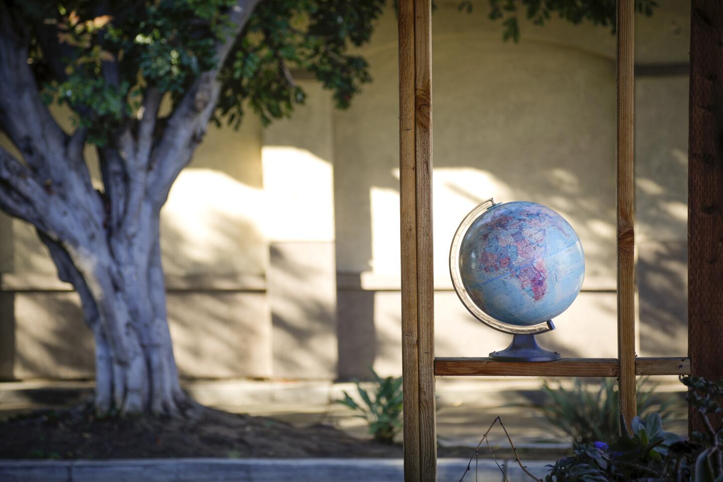 A desktop globe of the world is one of the many items at Lhooq Books, a funky vintage bookstore in Carlsbad Village. Sean Christopher, the owner recently received a 60-day eviction notice for both the shop and the adjoining house where he has raised his son, alone. He's hoping to achieve a stay of eviction on the property long enough to sell off his book inventory and find a new space without going bankrupt and ending up homeless with his son.