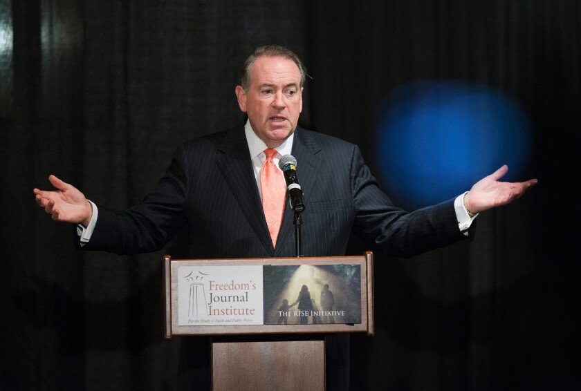 Republican presidential hopeful and former Arkansas Governor Mike Huckabee speaks at an event in Tinley Park, Illinois that was billed as a "frank discussion on defending the sanctity of life from conception to natural death."