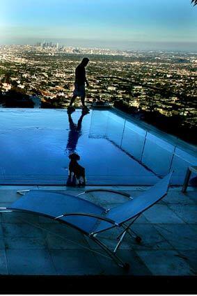 Don Goldstone and his crew spent two years building an infinity pool in Lee Feldman's Hollywood Hills home where the backyard is a straight drop down.