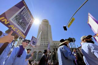 LOS ANGELES CA AUGUST 8, 2023 - Thousands of city workers walked a picket line out in front of Los Angeles City Hall Tuesday, Aug. 8, 2023, for a scheduled 24-hour work stoppage prompted by what their union believes is a lack of good-faith labor negotiations. (Gary Coronado / Los Angeles Times