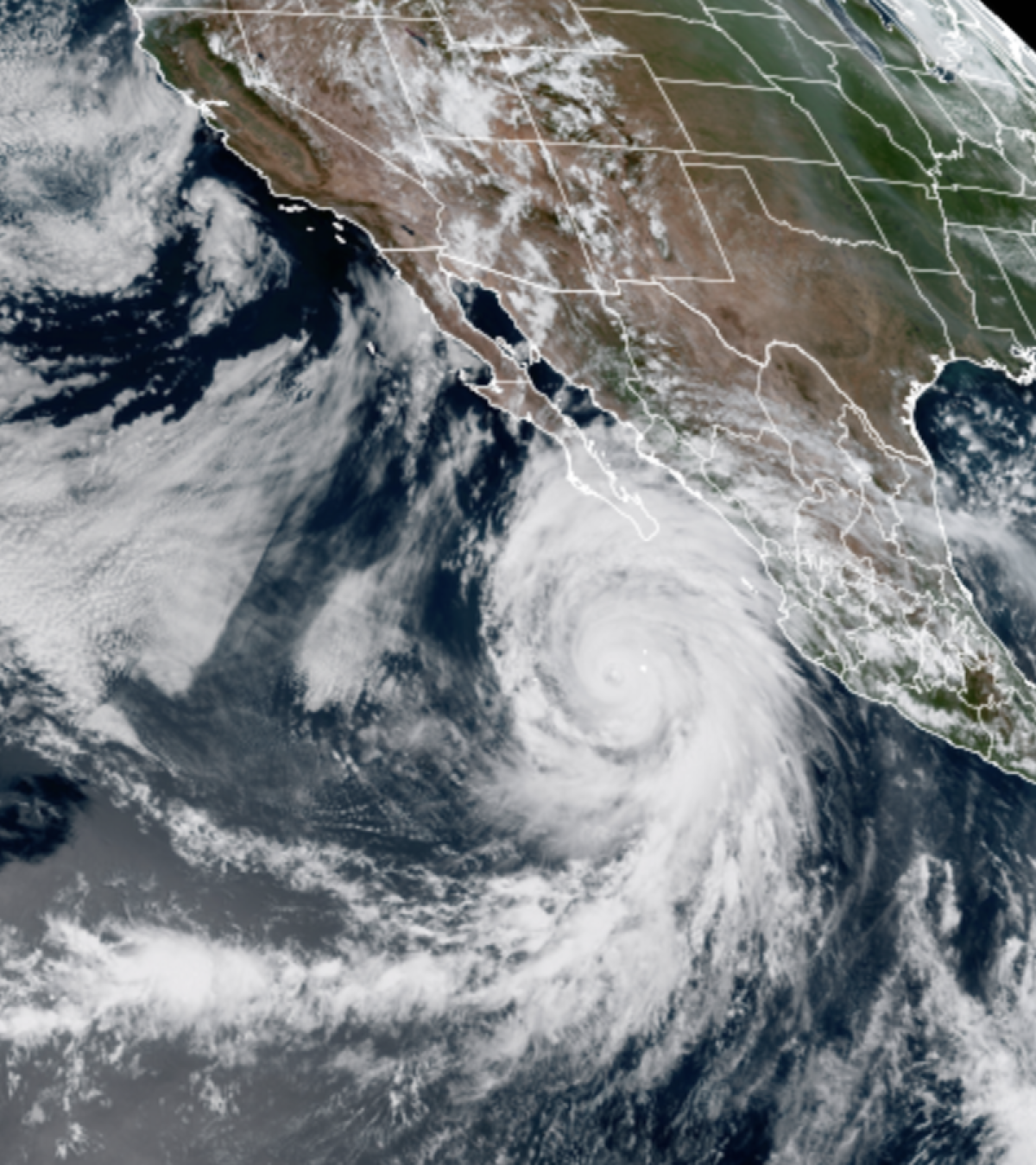 Hurricane Hilary gained strength and began to pass over Baja California Sur on Friday.