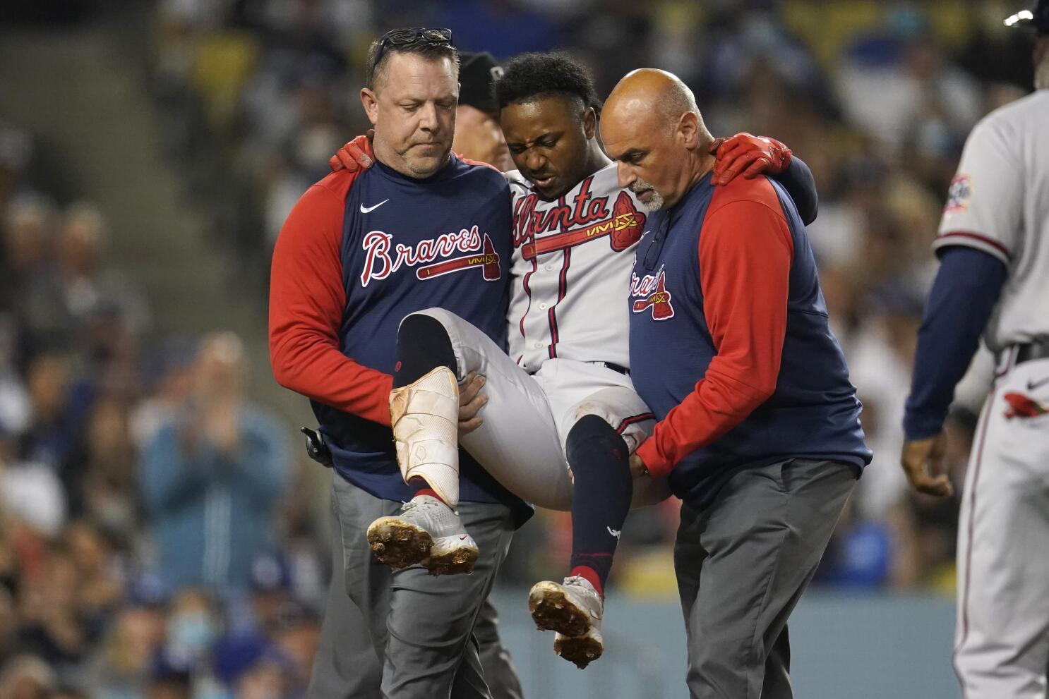 Braves star Albies carried away after fouling ball off knee - The San Diego  Union-Tribune