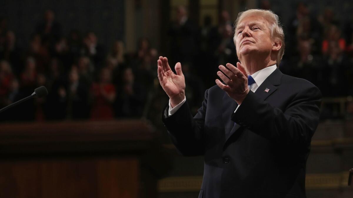 President Trump claps at his first State of the Union address on Tuesday.