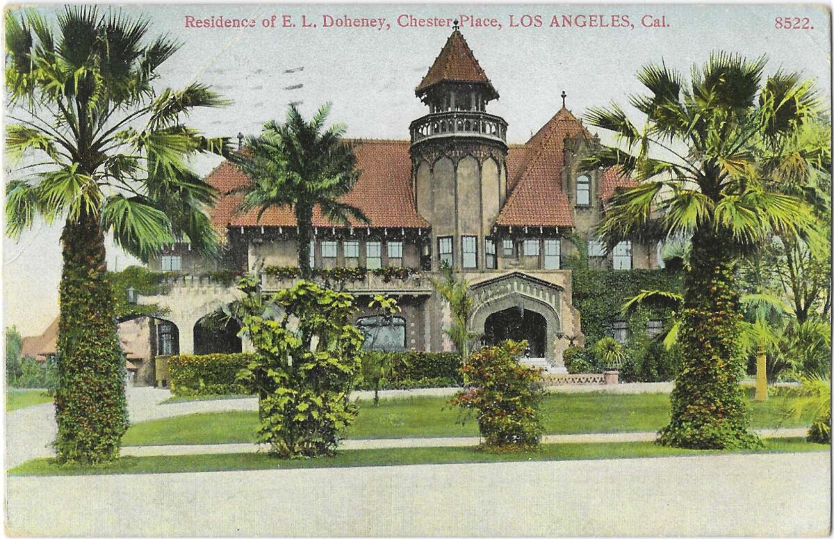 Palm trees rise in the foreground, with a large, ornate home behind