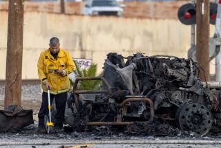 WILMINGTON, CA - FEBRUARY 16: LAFD Arson investigators at the the scene of a truck explosion that injured nine firefighters, two critically injured. Police cordoned off the area for investigation around 1100 block of North Almeda Street Wilmington, CA. (Irfan Khan / Los Angeles Times)
