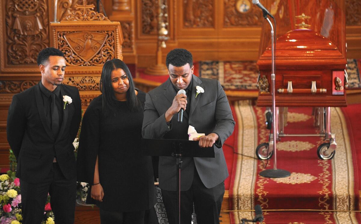 The three children of San Bernardino shooting victim Isaac Amanios speak during his funeral service Saturday in Colton.