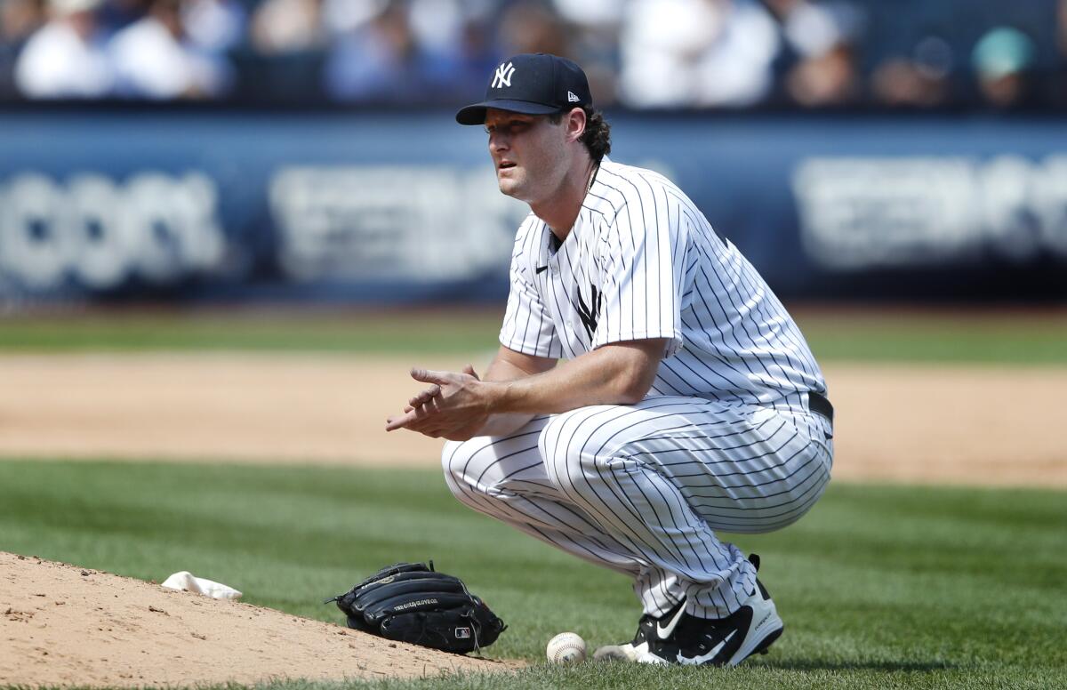 New York Yankees starting pitcher Gerrit Cole (45) waits for a replay result against the Toronto Blue Jays during the fifth inning of a baseball game Saturday, August 20, 2022, in New York. (AP Photo/Noah K. Murray)