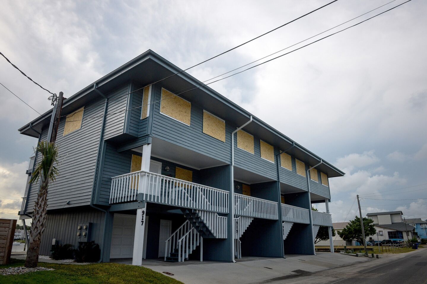 Plywood protects the doors and windows of a property ahead of Hurricane Florence in Carolina Beach, N.C.