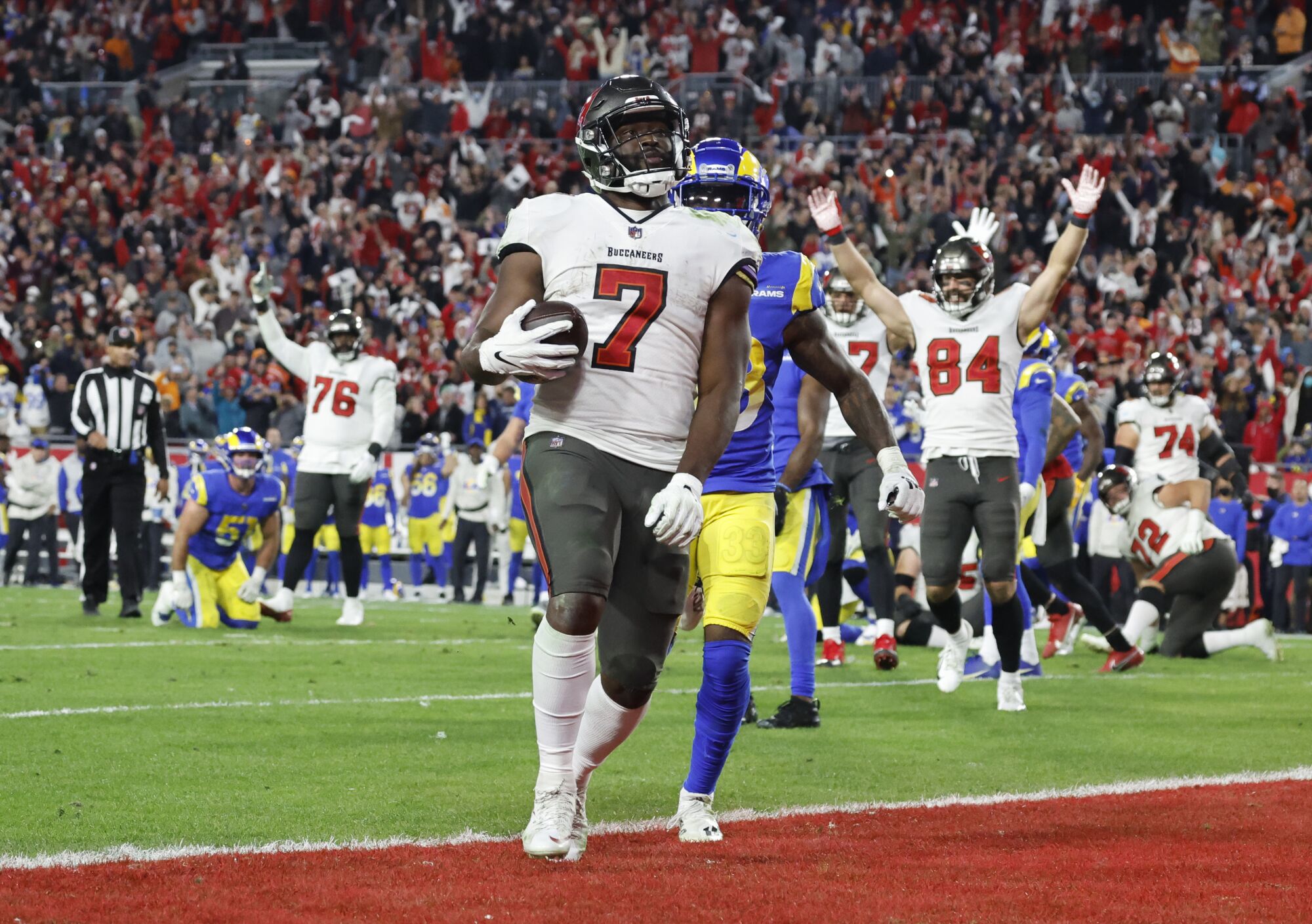 Tampa Bay Buccaneers running back Leonard Fournette scores on a 9-yard run on fourth down