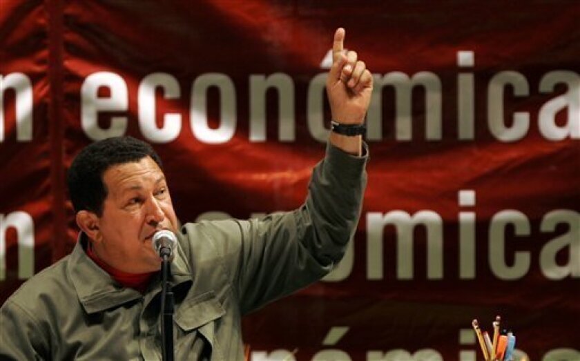 In this Feb. 6, 2009 file photo, Venezuela's President Hugo Chavez delivers a speech during an event in Caracas. Opponents say a series of moves by the socialist leader's allies, including targeted corruption probes and laws shifting power away from opposition-held offices, mark a power grab by Chavez at a time when he's feeling emboldened by a referendum win allowing indefinite re-election. (AP Photo/Ariana Cubillos, file)