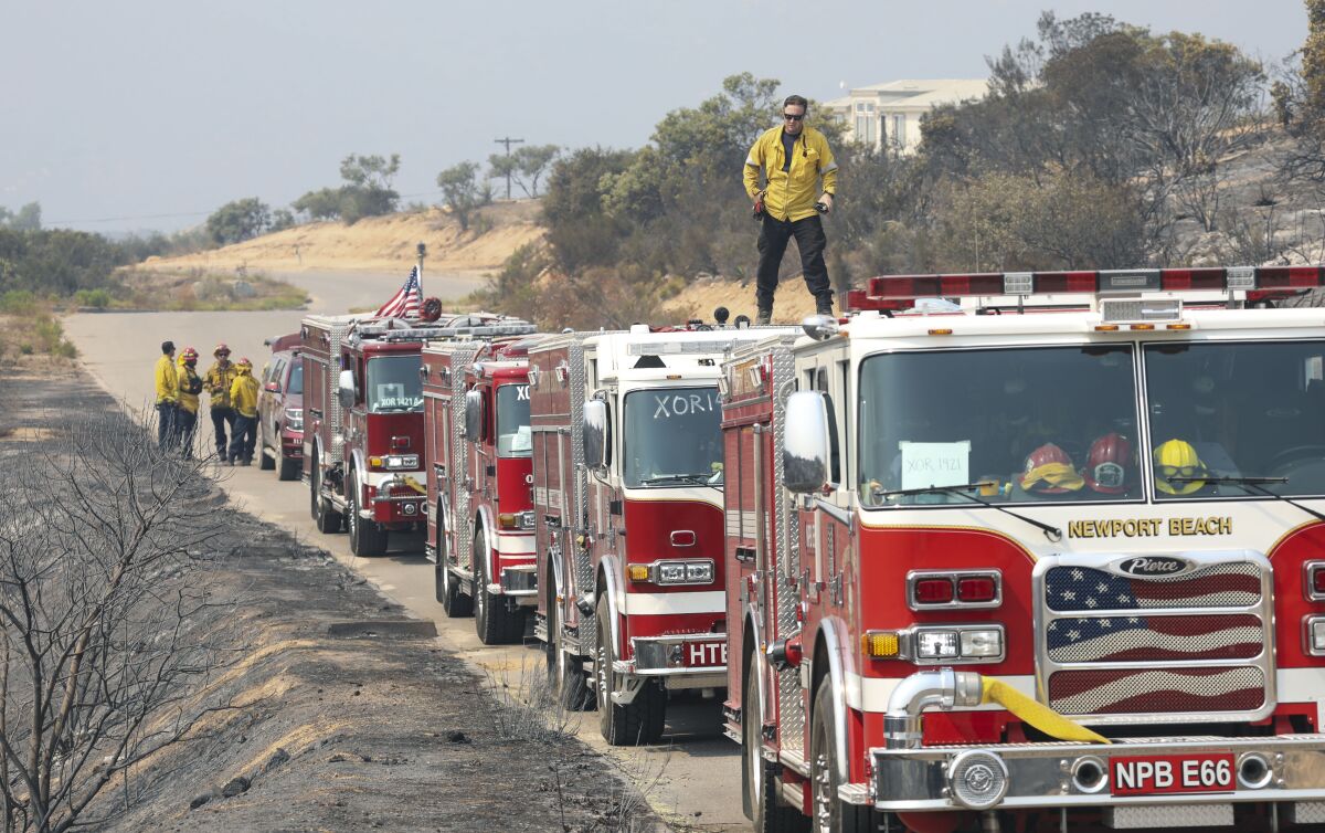 Firefighters stage along Montiel Truck Trail on Monday, September 7, 2020.