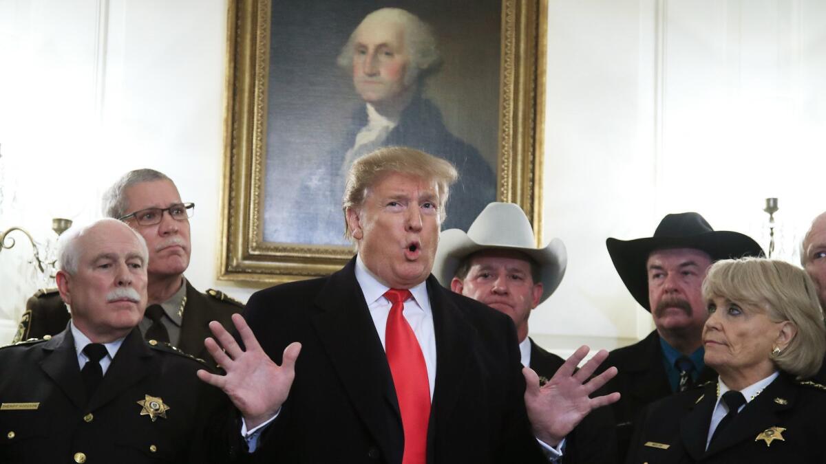 President Trump speaks during a meeting with a group of sheriffs from around the country before leaving the White House in Washington for a trip to El Paso, Texas on Feb. 11.