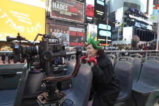 Carrie Preston rides through New York's Times Square in "Elsbeth."