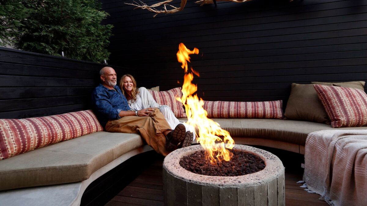 VENICE, CA - NOVEMBER 1, 2016 - Paul Hibler and his wife Tiffany Rochelle enjoy a sitting area that feature a fire pit at their Venice home on November 1, 2016. (Genaro Molina / Los Angeles Times)