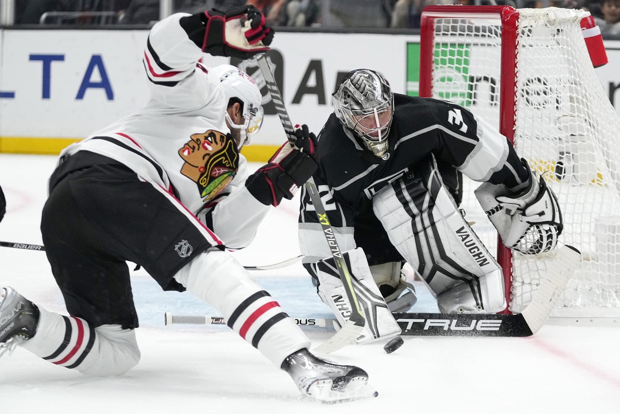 Blackhawks center Andreas Athanasiou tries to score on Kings goaltender Jonathan Quick 