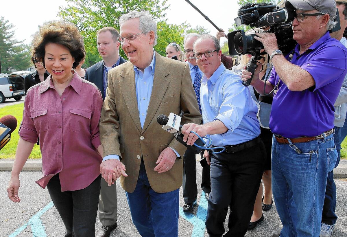 Sen. Mitch McConnell and his wife, Elaine Chao, after voting in Kentucky's Republican primary, in which McConnell defeated tea party favorite Matt Bevin.